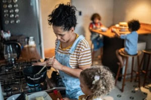 Mother and children cooking together